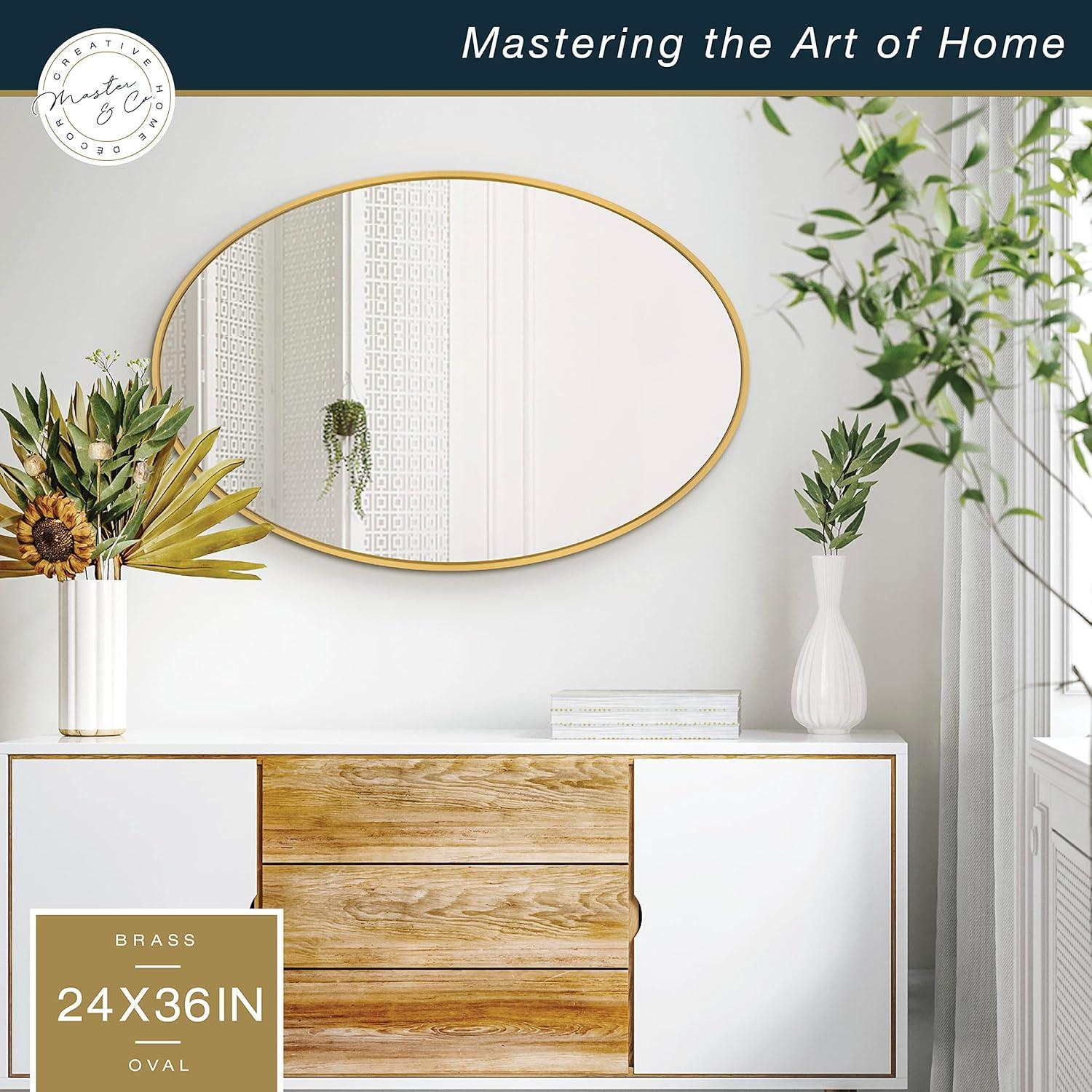 imageMCS Master ampamp Co Modern Metal Large Wall Mirror Minimalist Home Decor Oval Mirror for Living Room Bedroom or Bathroom 24 by 36 Inch Brass
